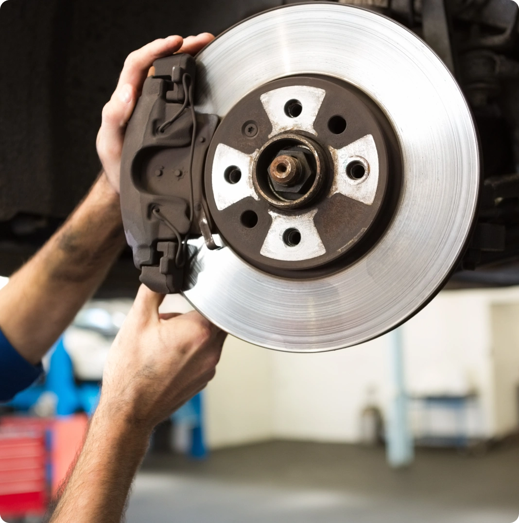 Mechanic Checking brake calliper