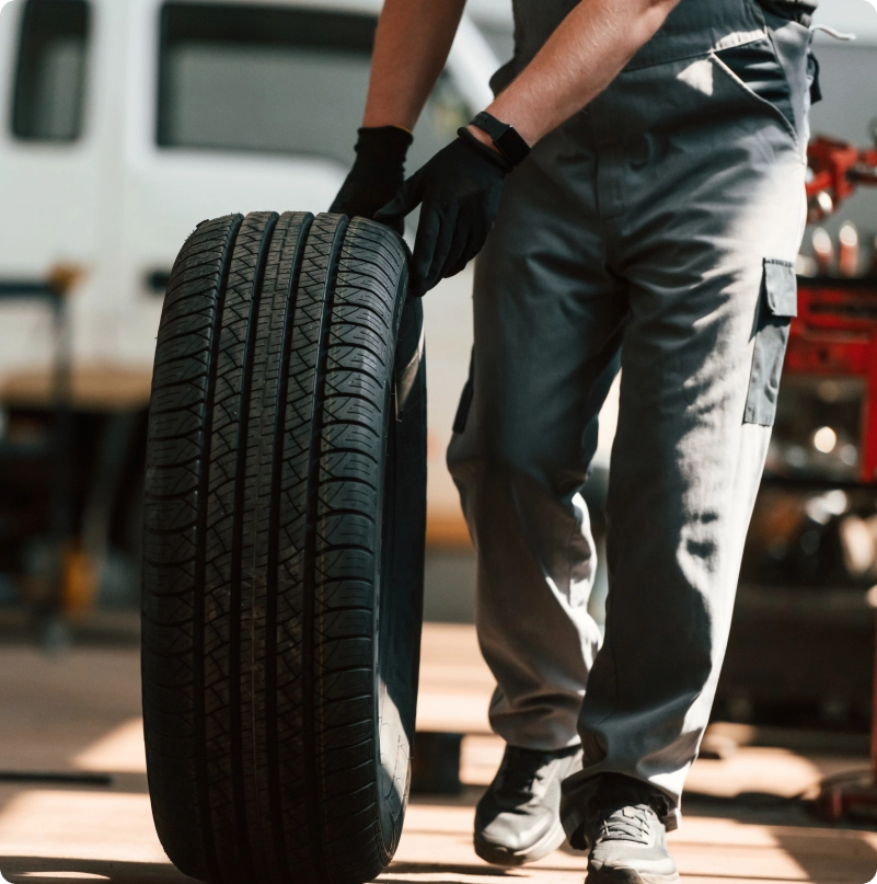Mechanic holding tire
